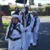 The Naval Air Station Color Guard presents the flag.